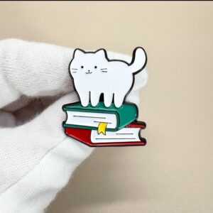 White Cat on Books Enamel Pin